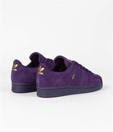 adidas purple and gold shoes.